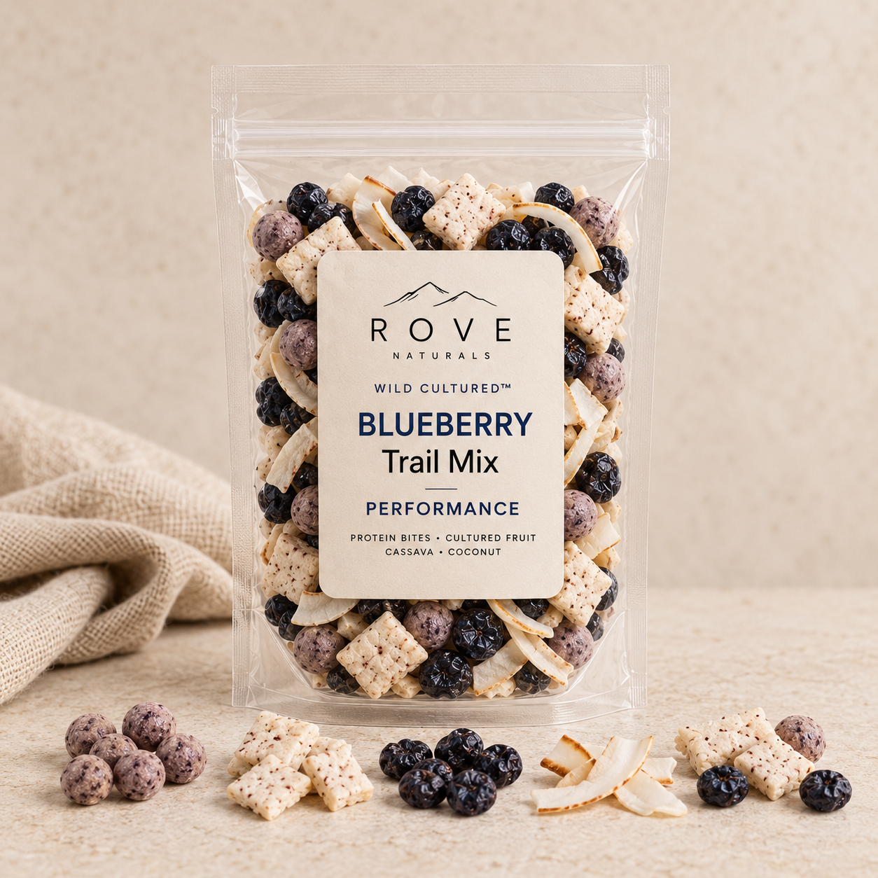 Rove blueberry performance trail mix with protein bites, cassava, coconut and cultured fruit in a clear pouch.