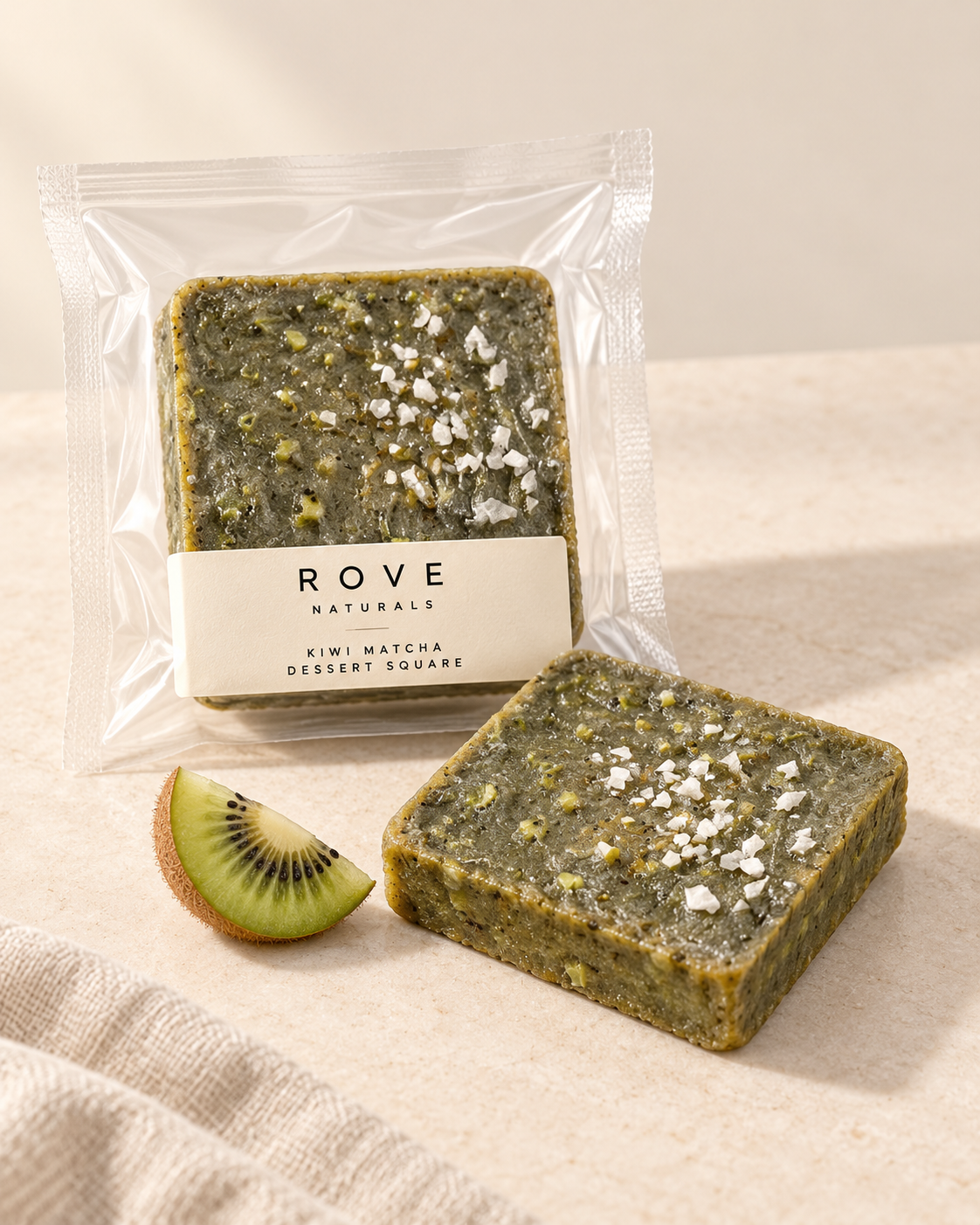 Rove kiwi matcha dessert square mockup, packaged and unwrapped on warm limestone.