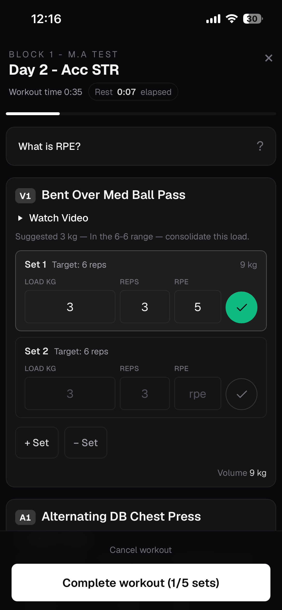 Ultimate Strength & Nutrition App live workout screen with completed set confirmation