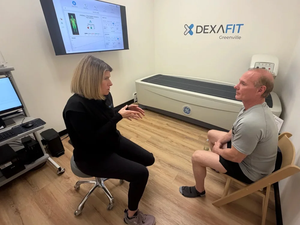 Nicole Weber explaining DEXA results to a client at DexaFit Greenville