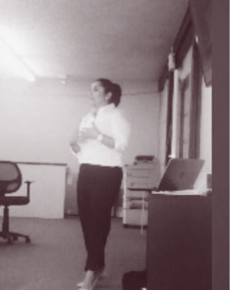 Lissette teaching in a training room