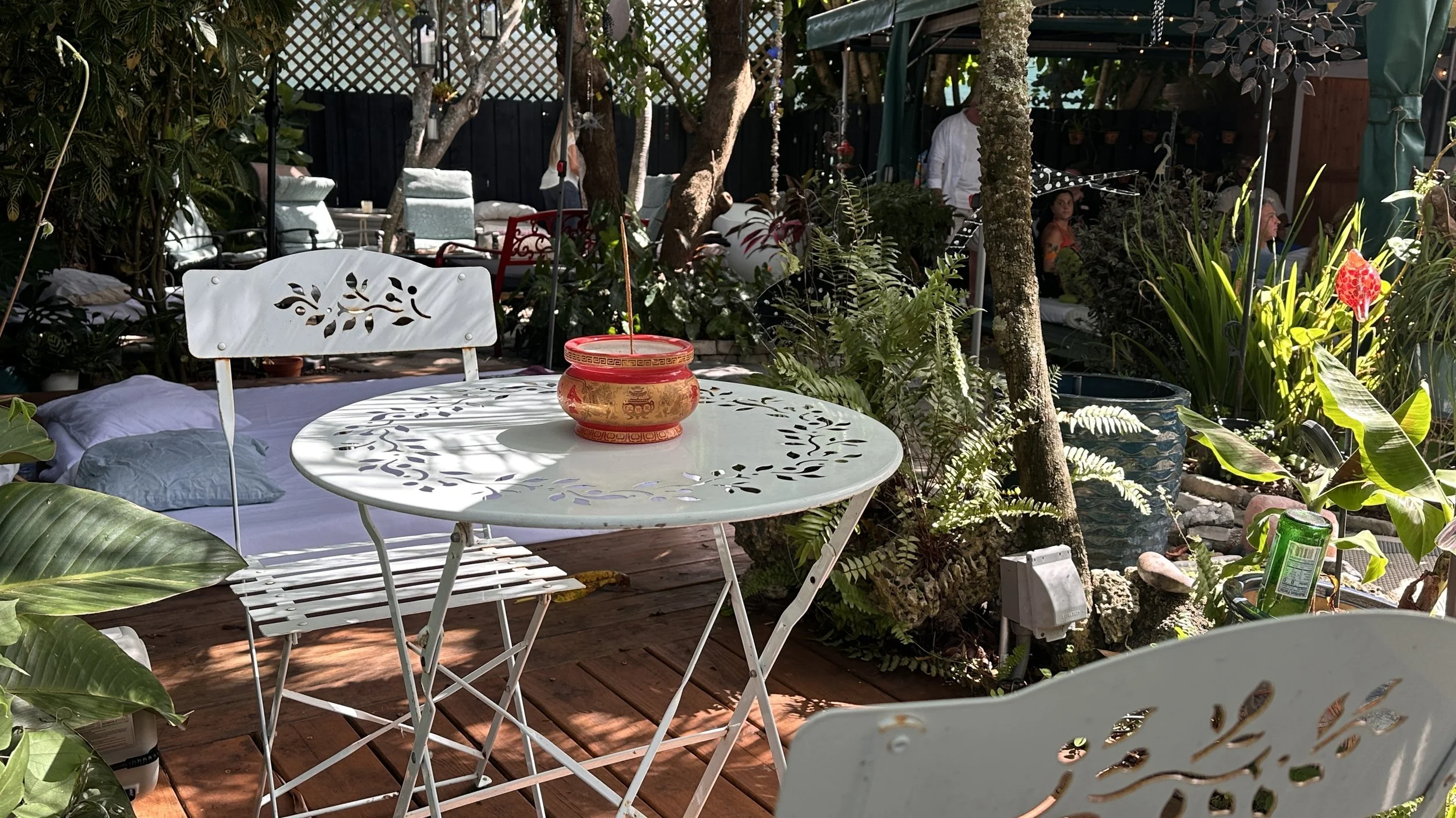 Round table and chairs set among the plants