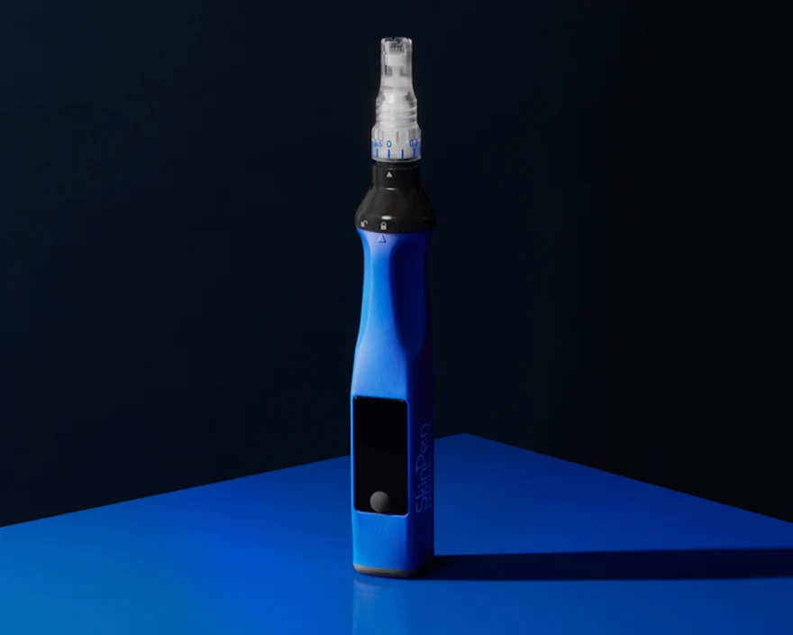 SkinPen Precision Elite microneedling device on a dark blue background