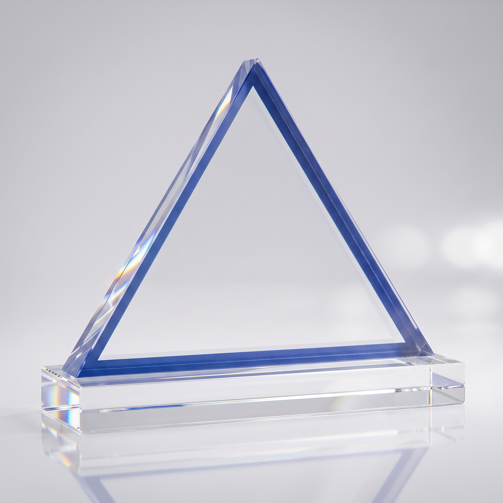 Clear triangular award with blue edges on a clear base