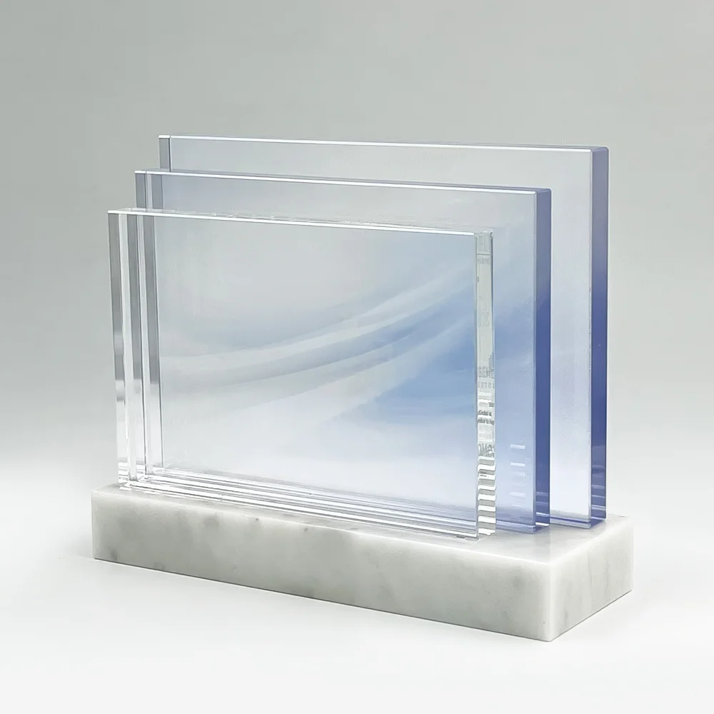 Layered clear acrylic panels with pale blue accents on a white base