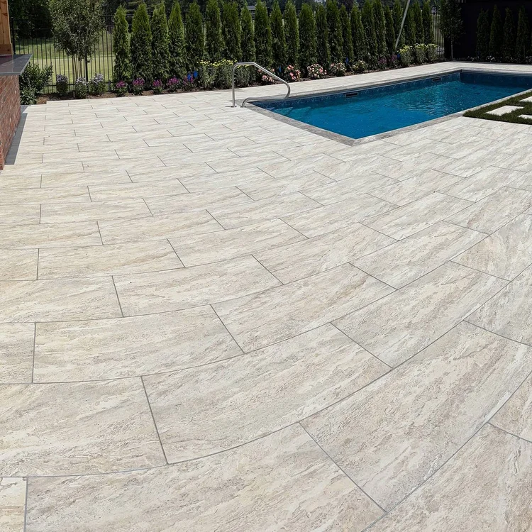 A wider view of the pool terrace and its surface joint layout.