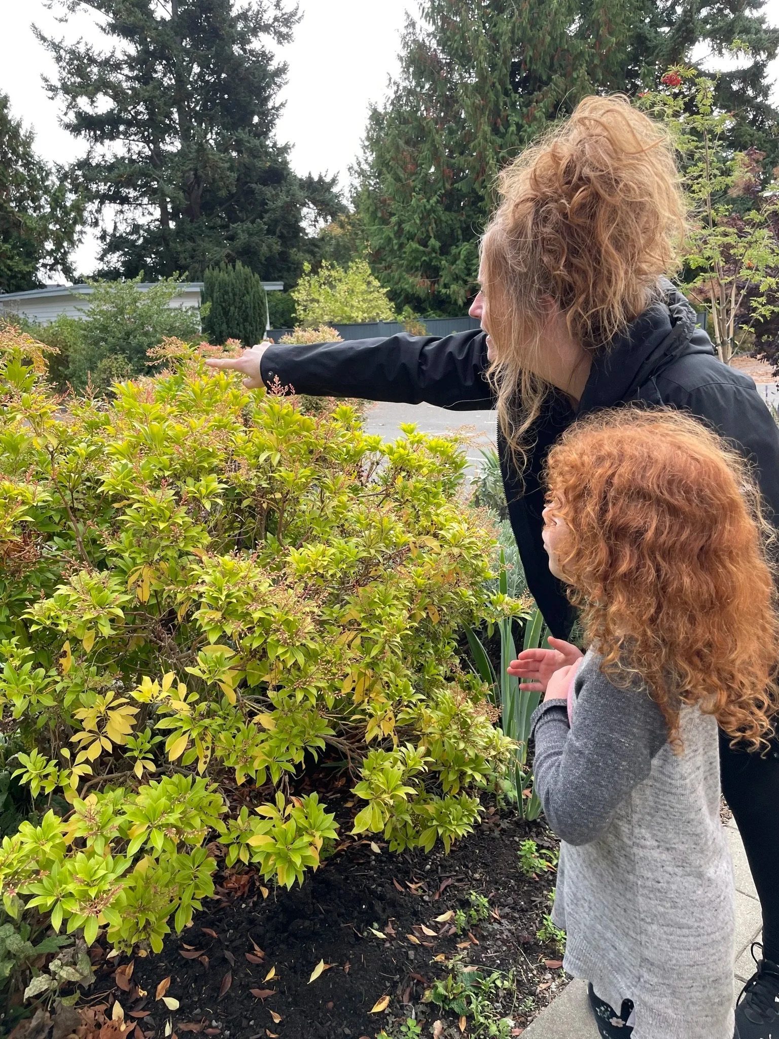 Student and teacher in the garden learning about plants