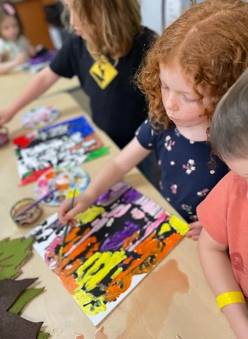 Young Student painting in class