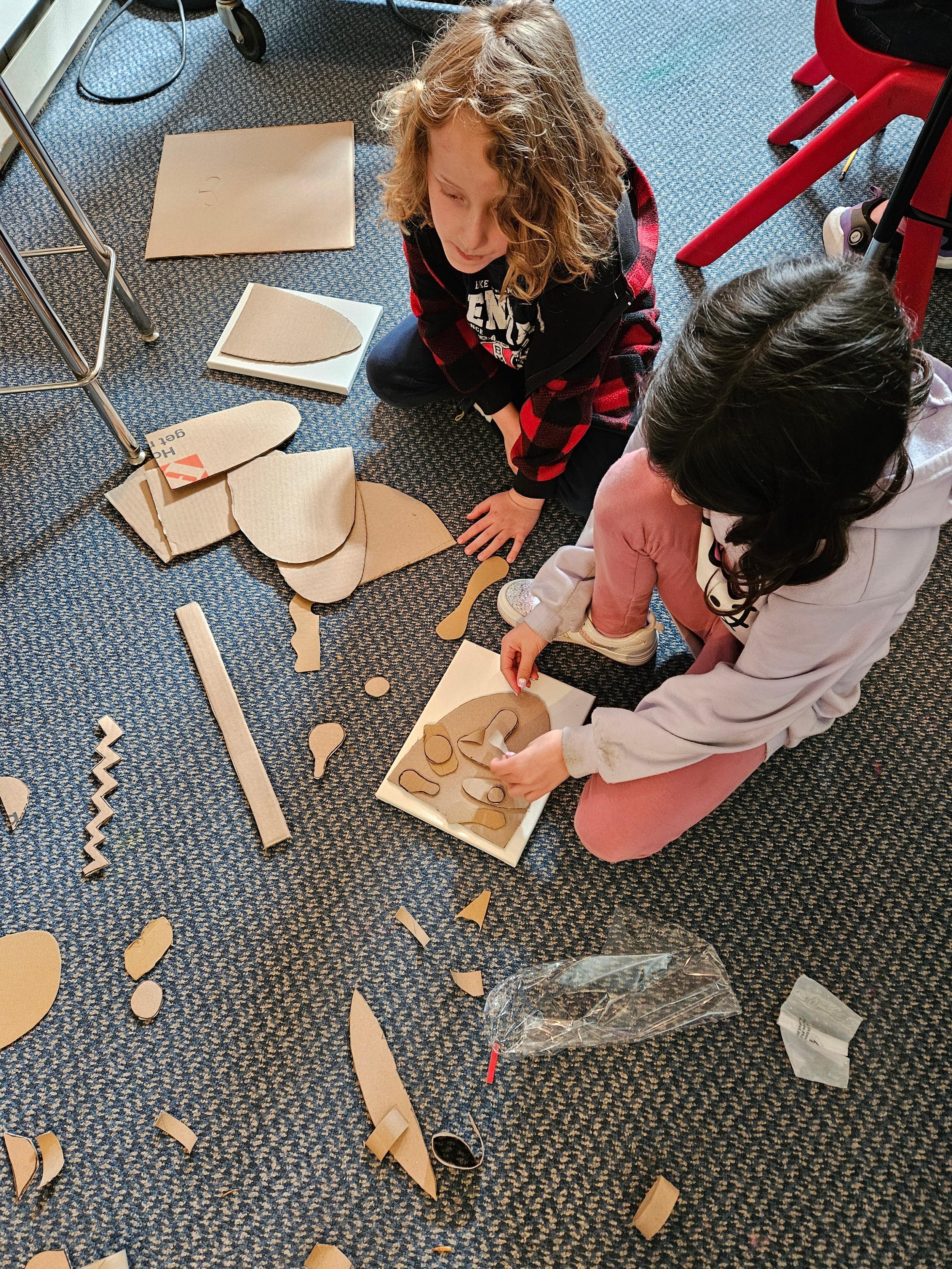 Students making arts and craft together in class