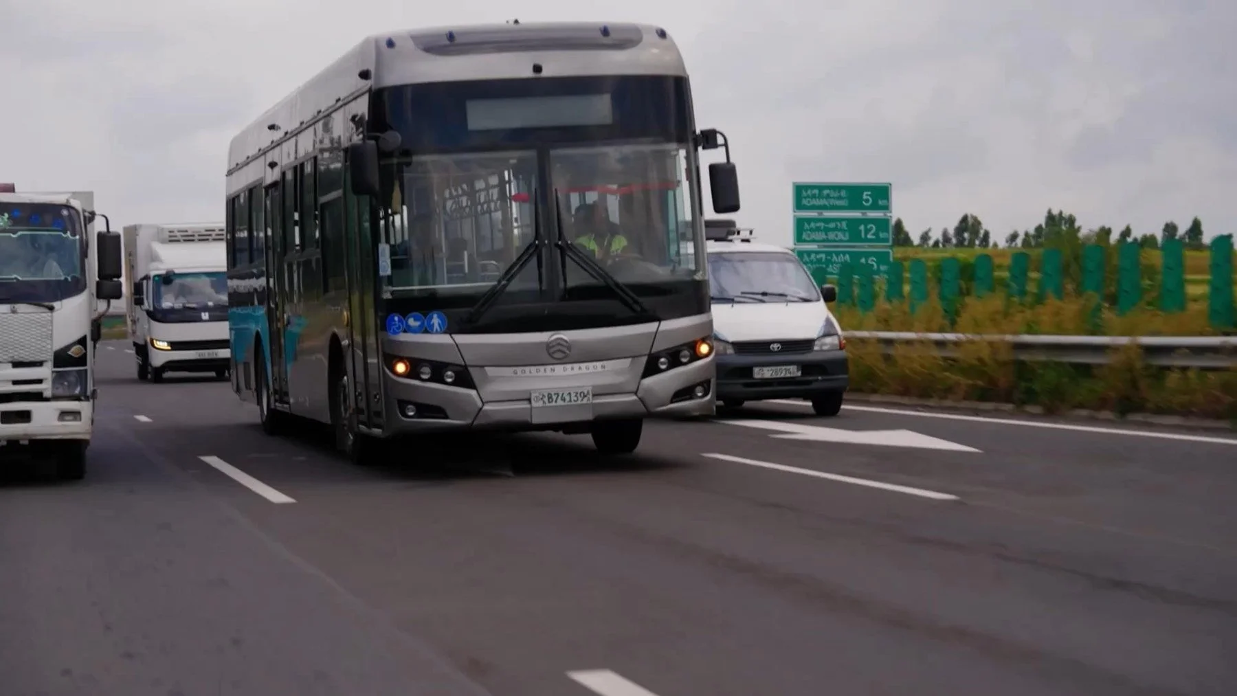 Electric bus and expedition team on the journey