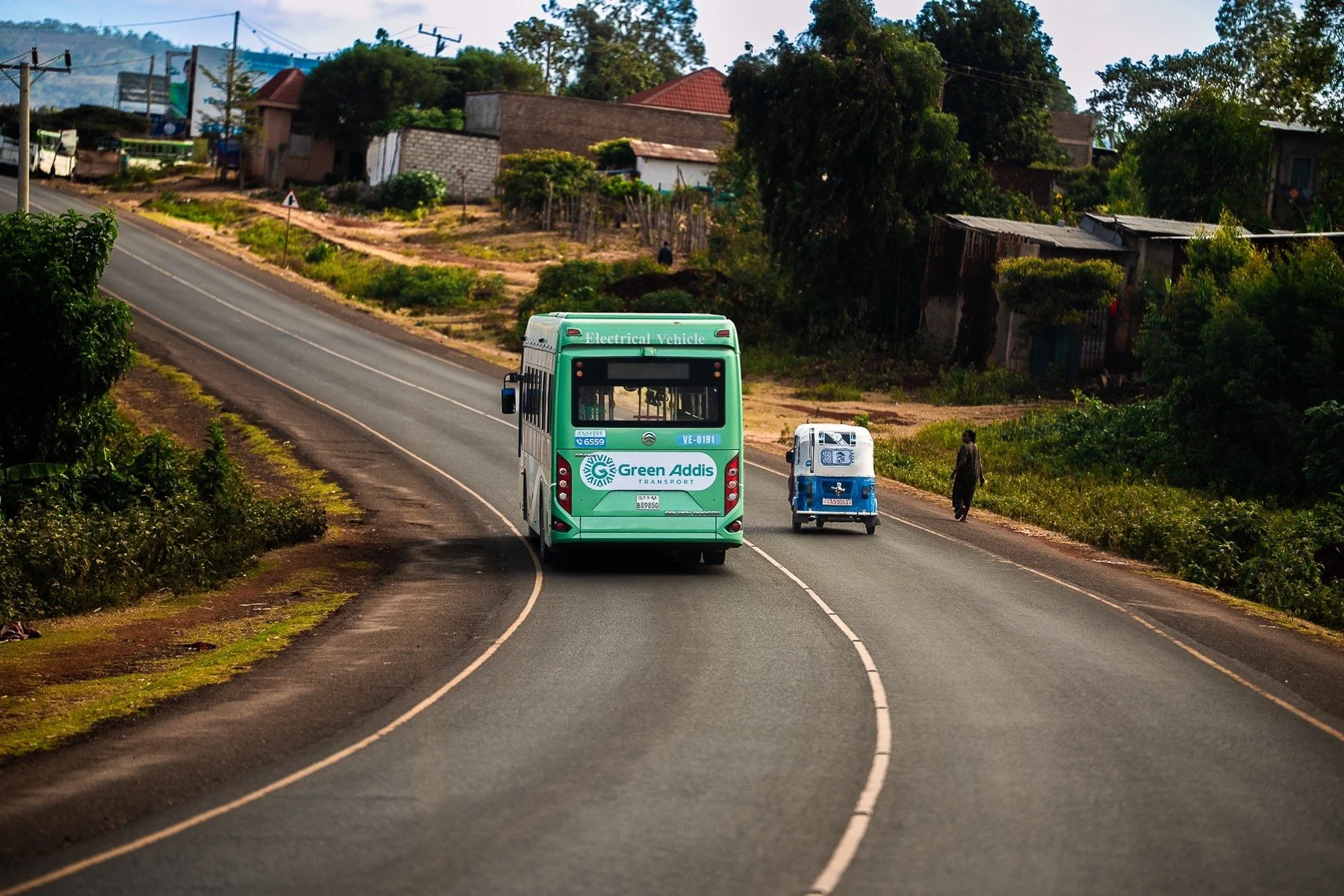 Electric bus travelling along a winding road during the expedition