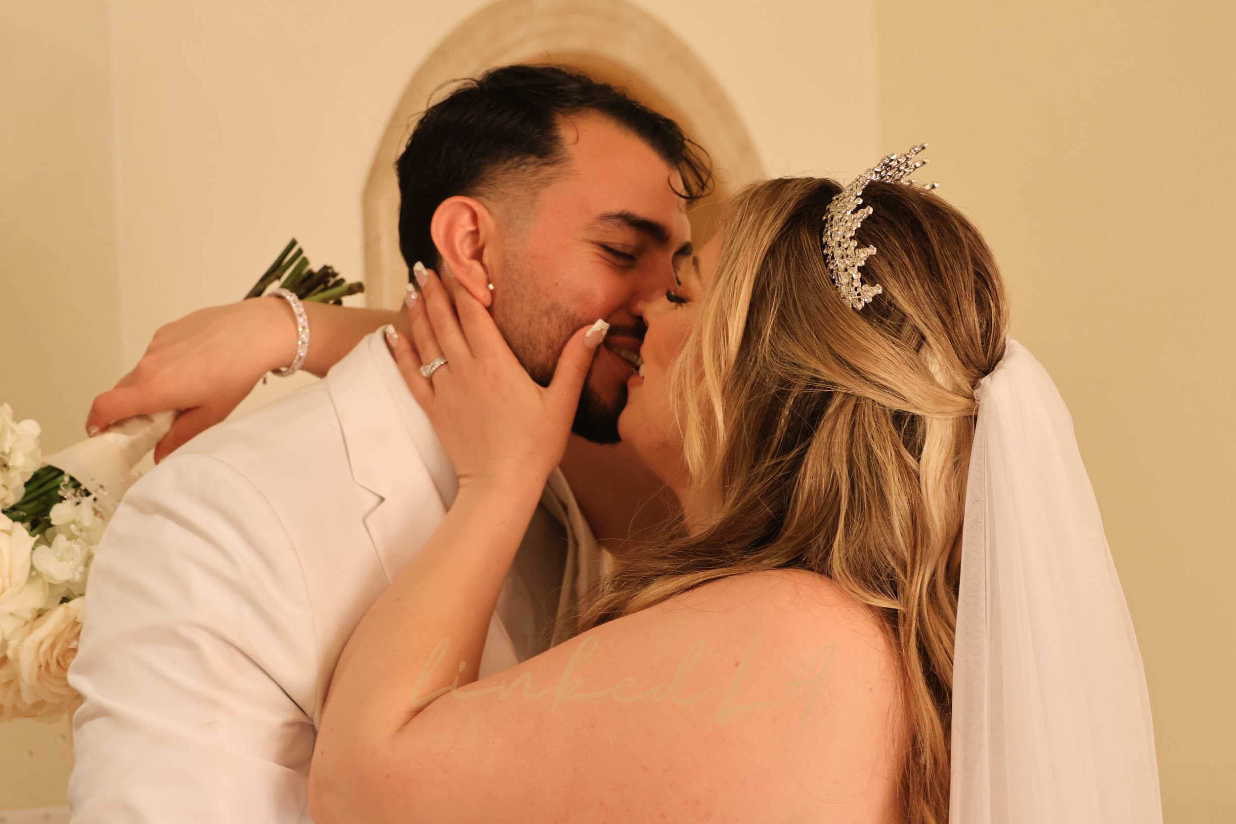 Wedding couple embracing during ceremony