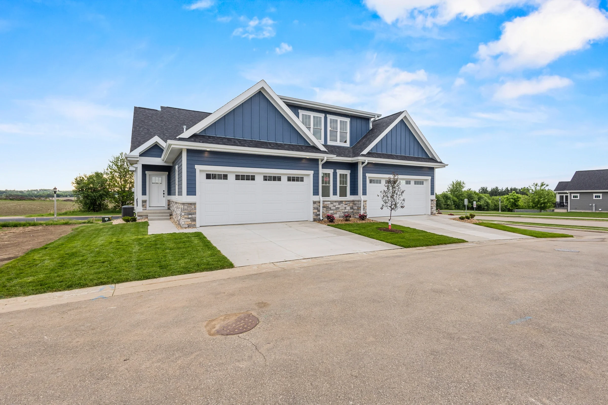 Irene Court — Front corner showing driveway and side elevation