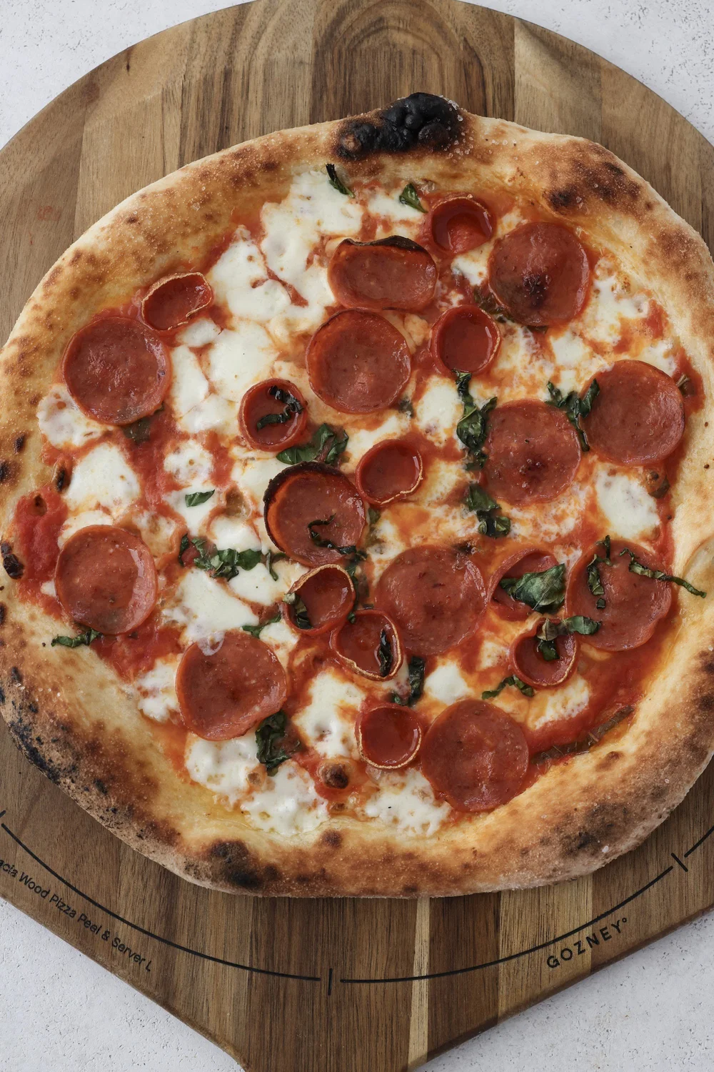 Whole round Neo-Neapolitan pepperoni pizza