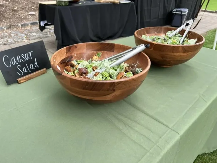 Caesar salad in wooden serving bowls