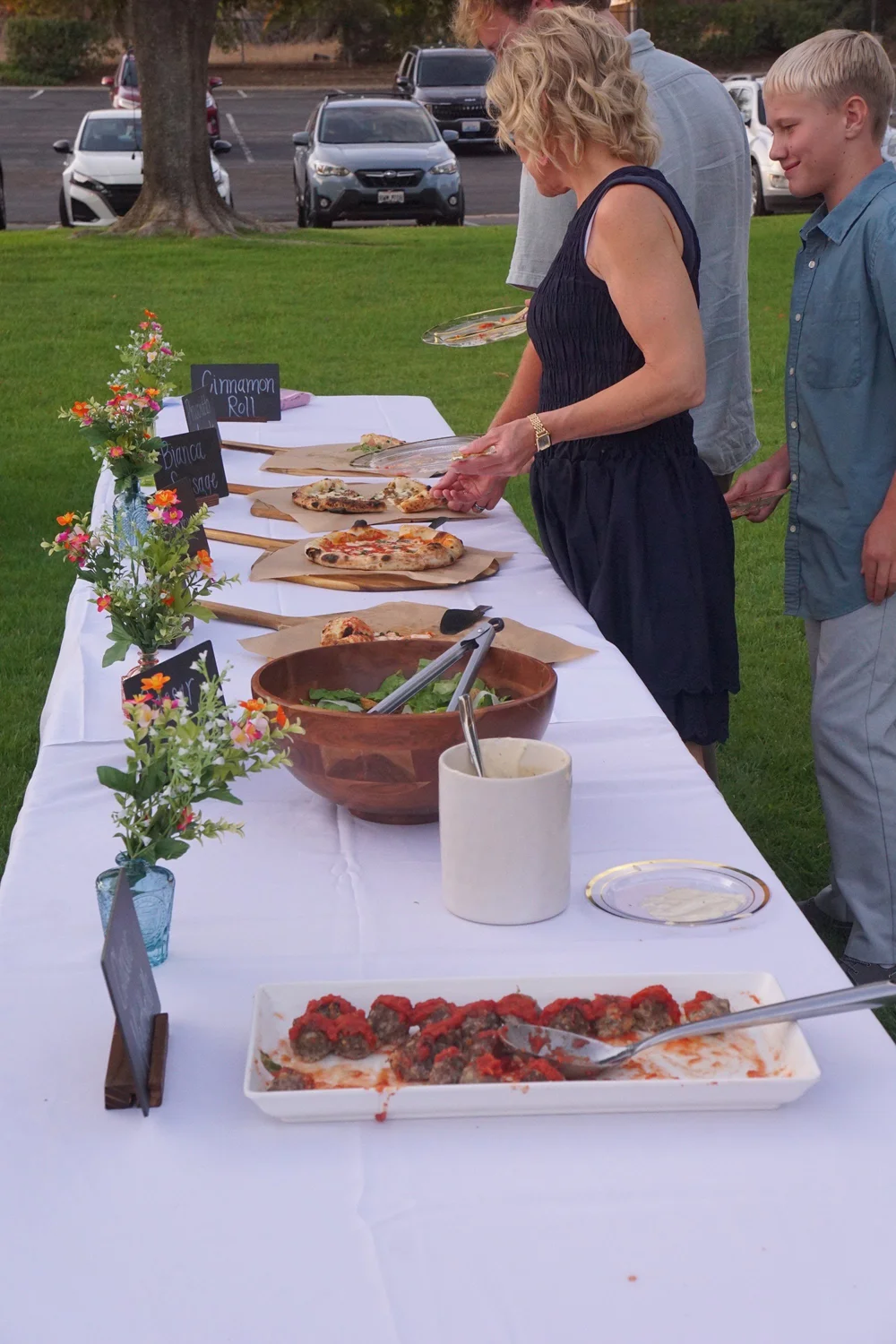 Pizza buffet table at an outdoor wedding reception