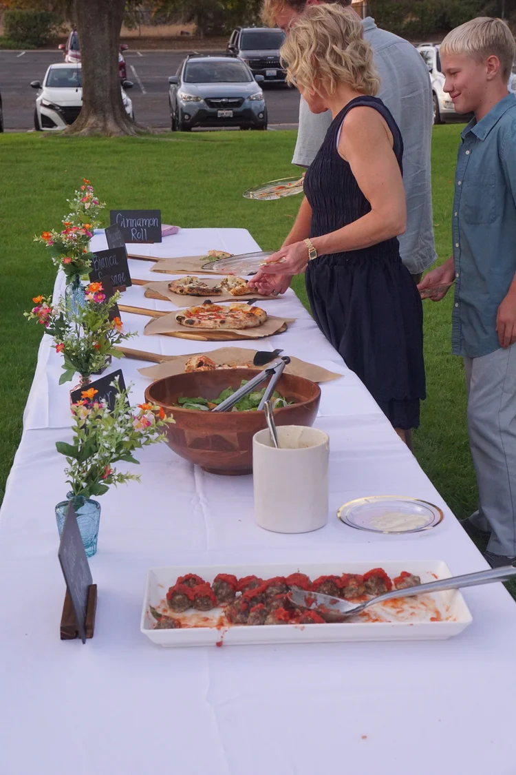 Pizza table at an outdoor wedding