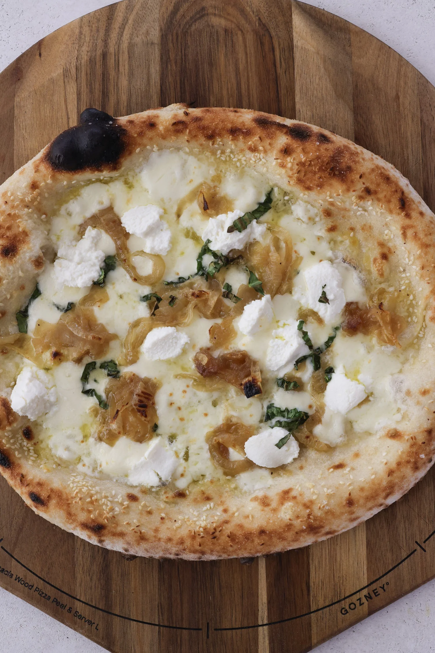 Ode to Brooklyn’s Best pizza with ricotta and caramelized onions