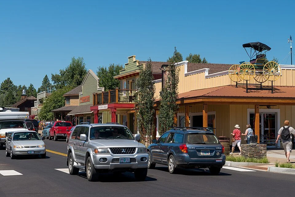 Western-style storefronts along a downtown street in Sisters, Oregon.