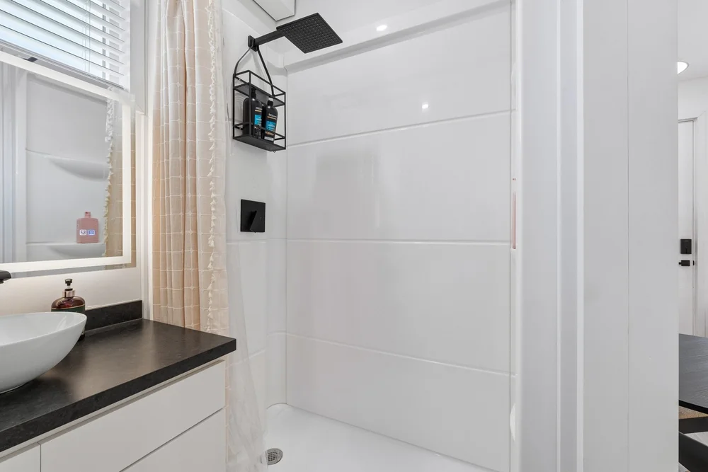 Clean Pasadera bathroom with vanity and shower