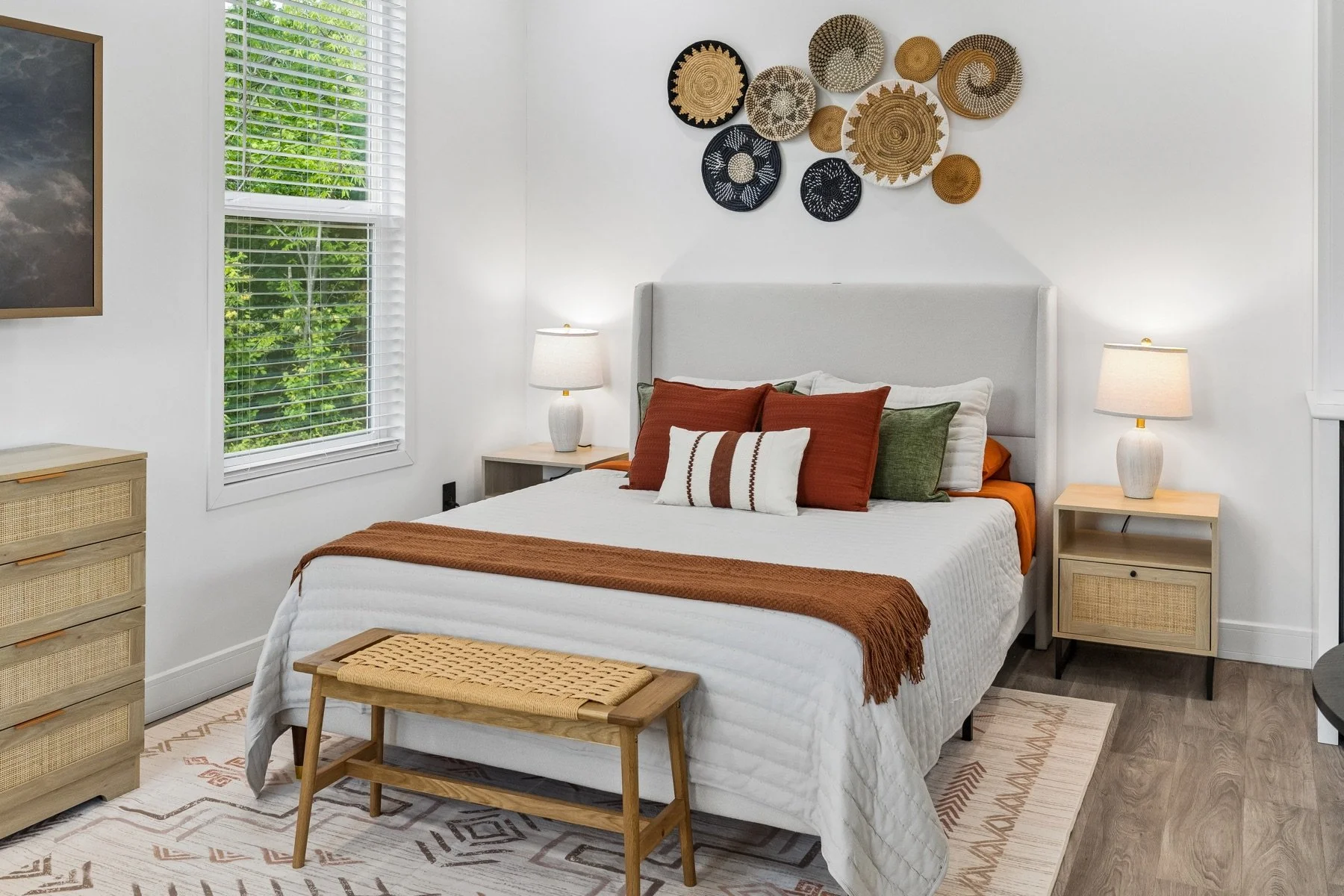 Made bed with pillows and bedside tables in a Pasadera rental