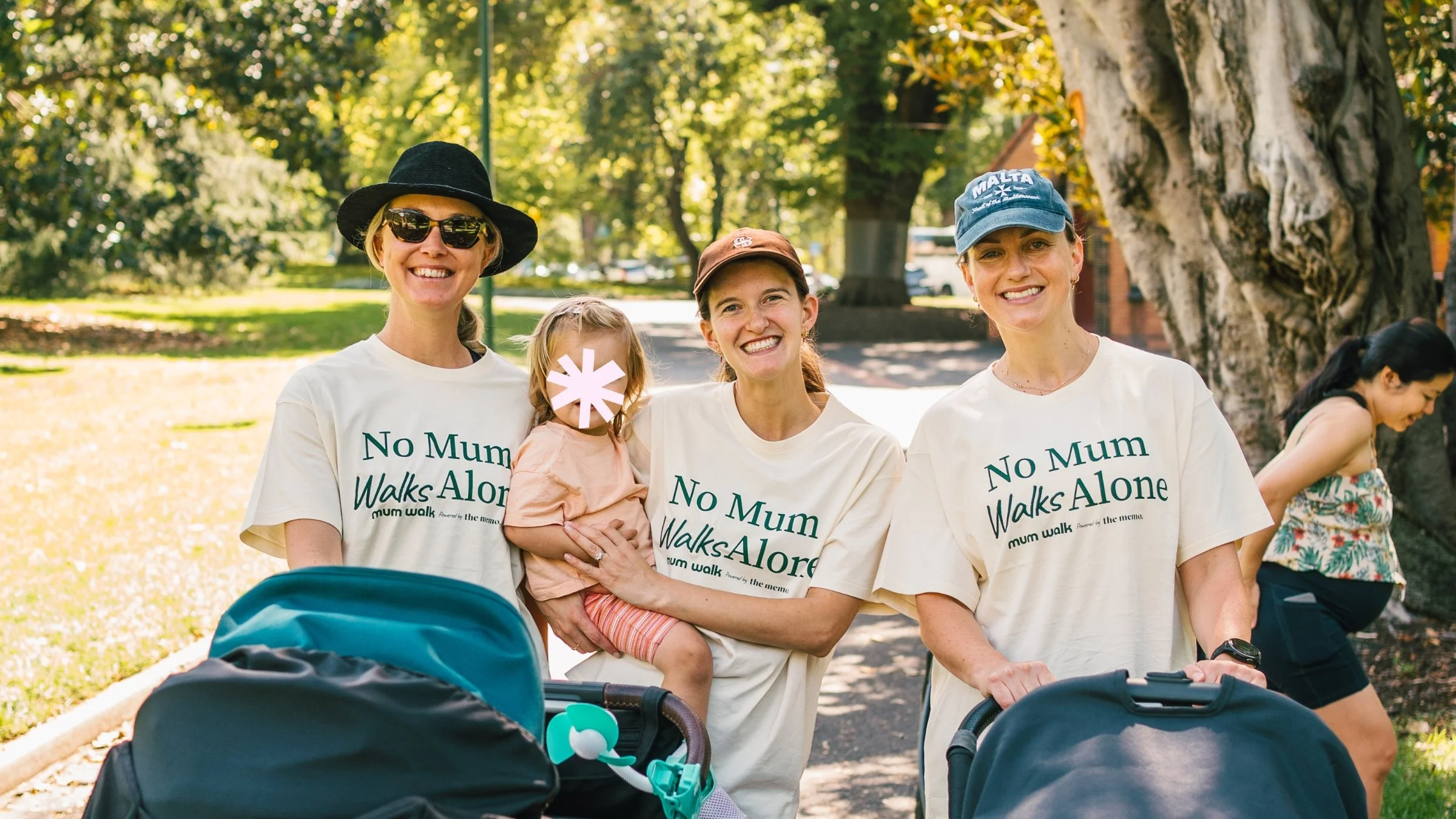 A long line of mums with prams along the foreshore