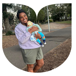 A Mum Walk leader holding her baby on a walk