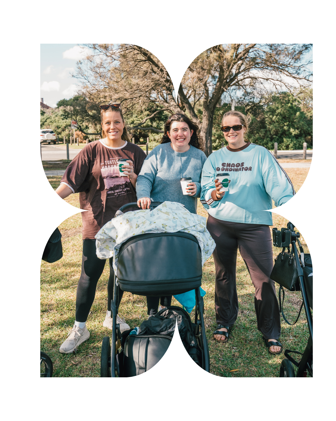 Three mums with prams laughing together