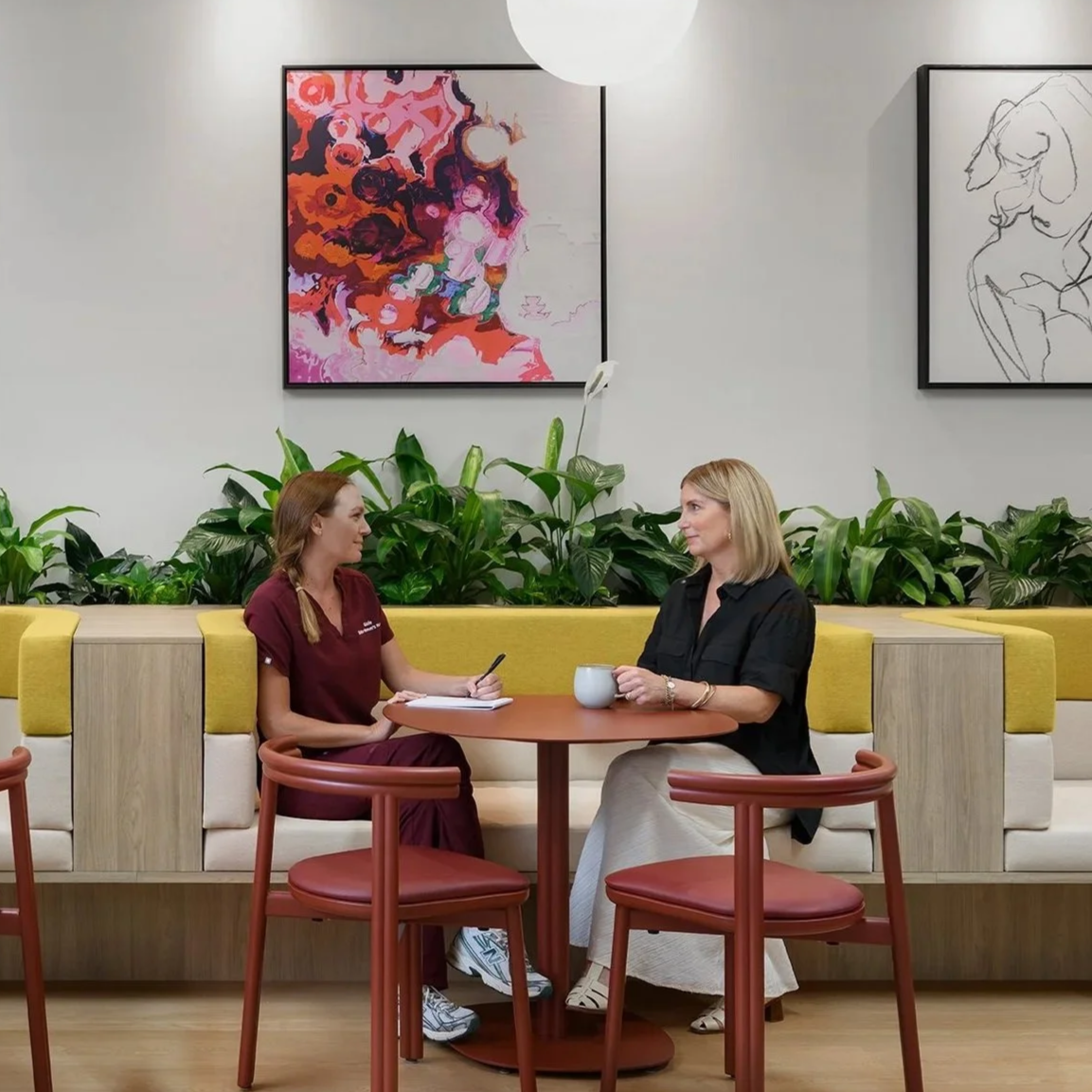Two women in conversation at Belle Women's Health