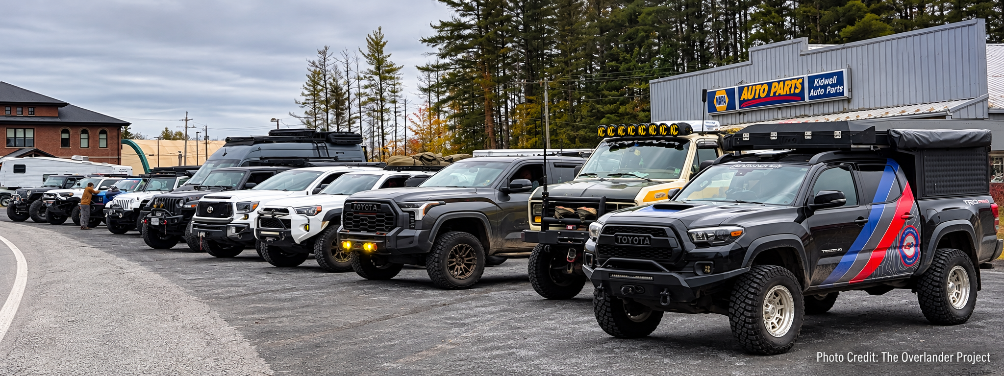 Overland trucks and vans from The Overlander Project's Monongahela Expedition lined up in a convoy in West Virginia. Photo credit: The Overlander Project
