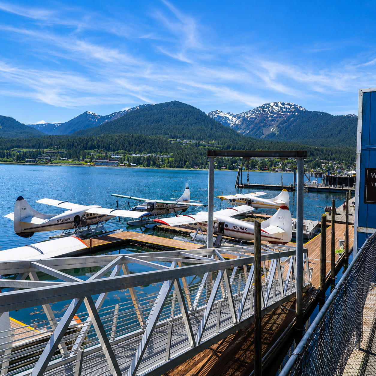 Seaplanes at the downtown Juneau harbor dock with mountains behind, departure point for the Taku Lodge floatplane excursion