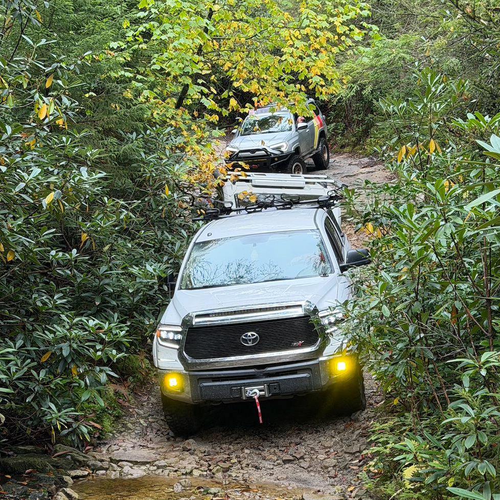 Overland vehicle working through the rocky off-road section of the Canaan Loop trail in the Monongahela National Forest, West Virginia