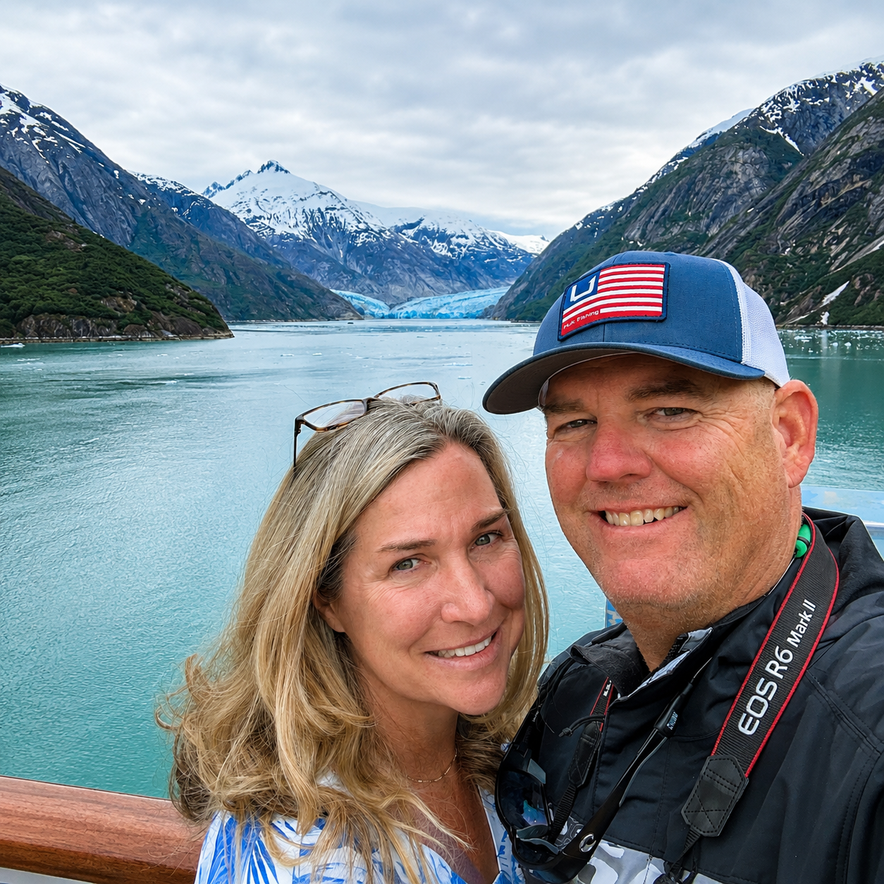 Dawes Glacier and Endicott Arm fjord behind cruise passengers on a Holland America Alaska cruise