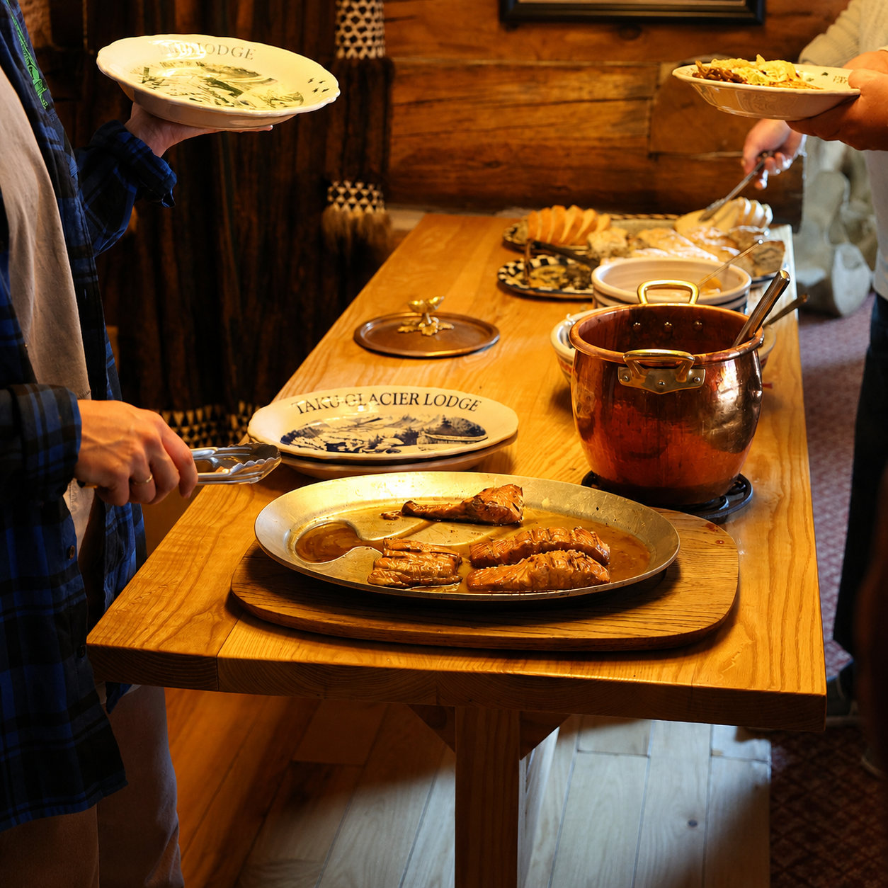 Salmon bake buffet spread at Taku Glacier Lodge with grilled salmon and homemade sides
