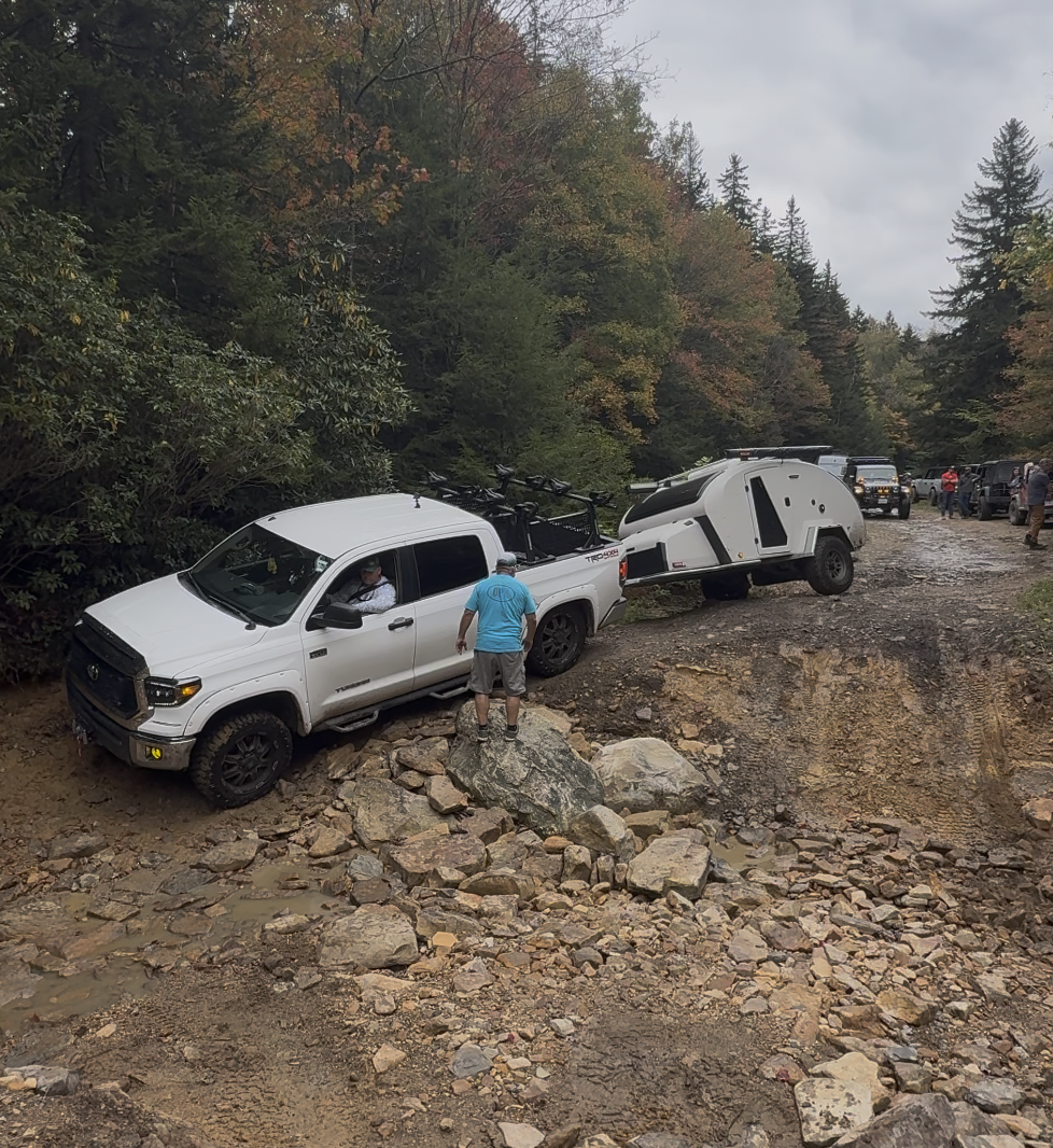 Toyota Tundra towing an Escapod Topo 2 teardrop trailer on the rocky Canaan Loop trail in the Monongahela National Forest, West Virginia