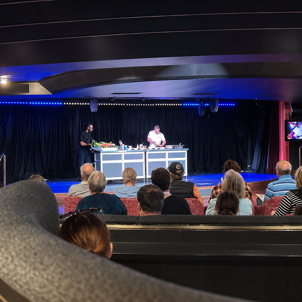 Chef-led cooking demonstration in the theater aboard Holland America Noordam