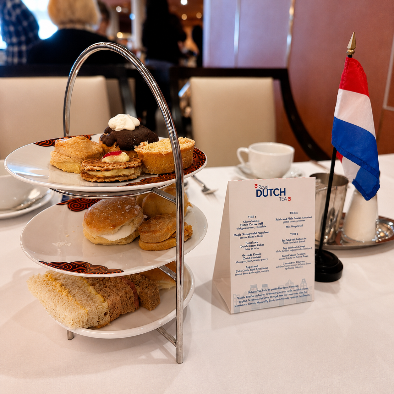 Royal Dutch afternoon tea service with tiered trays aboard Holland America Noordam