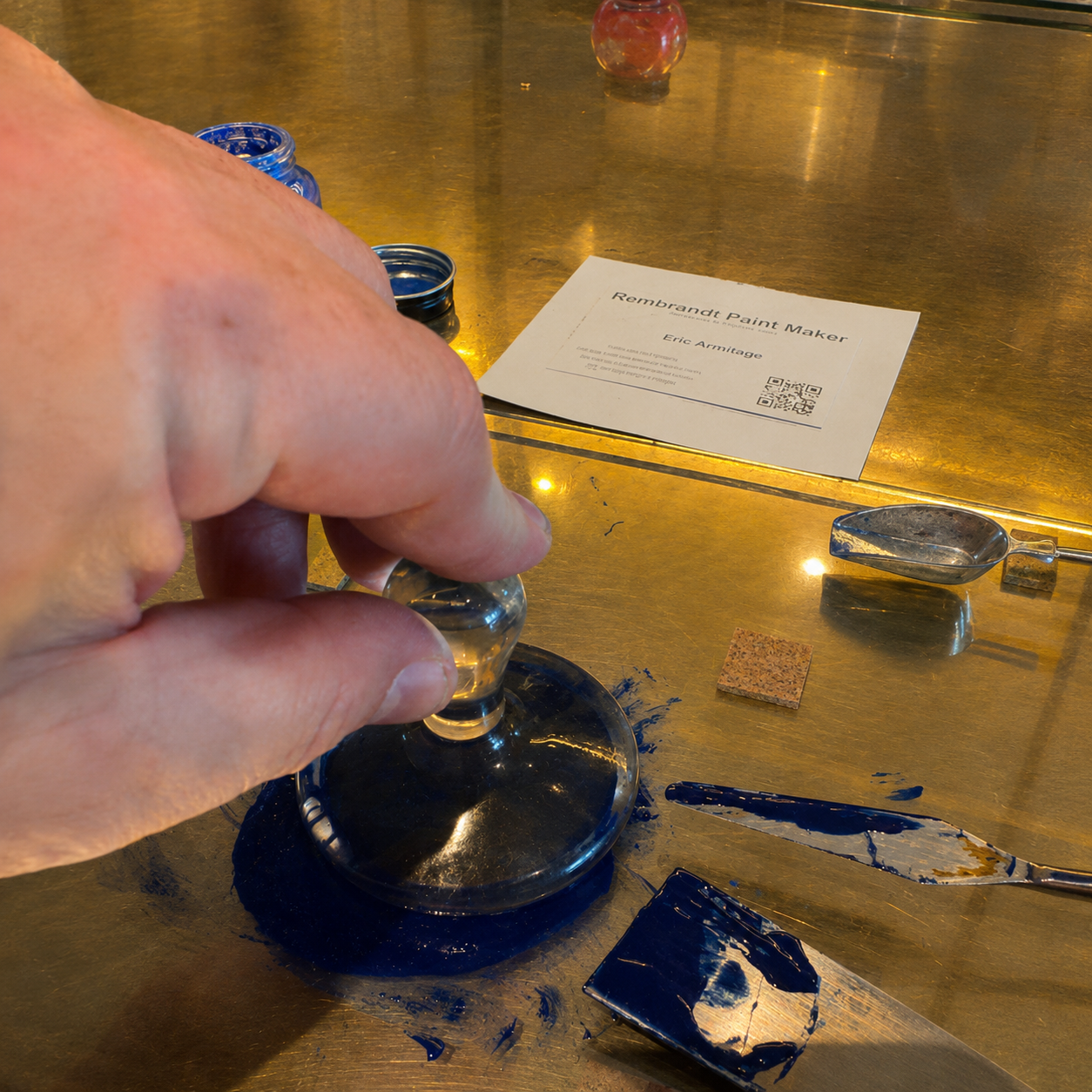 Mixing blue oil paint by hand at the Rembrandt paint-making workshop in Amsterdam