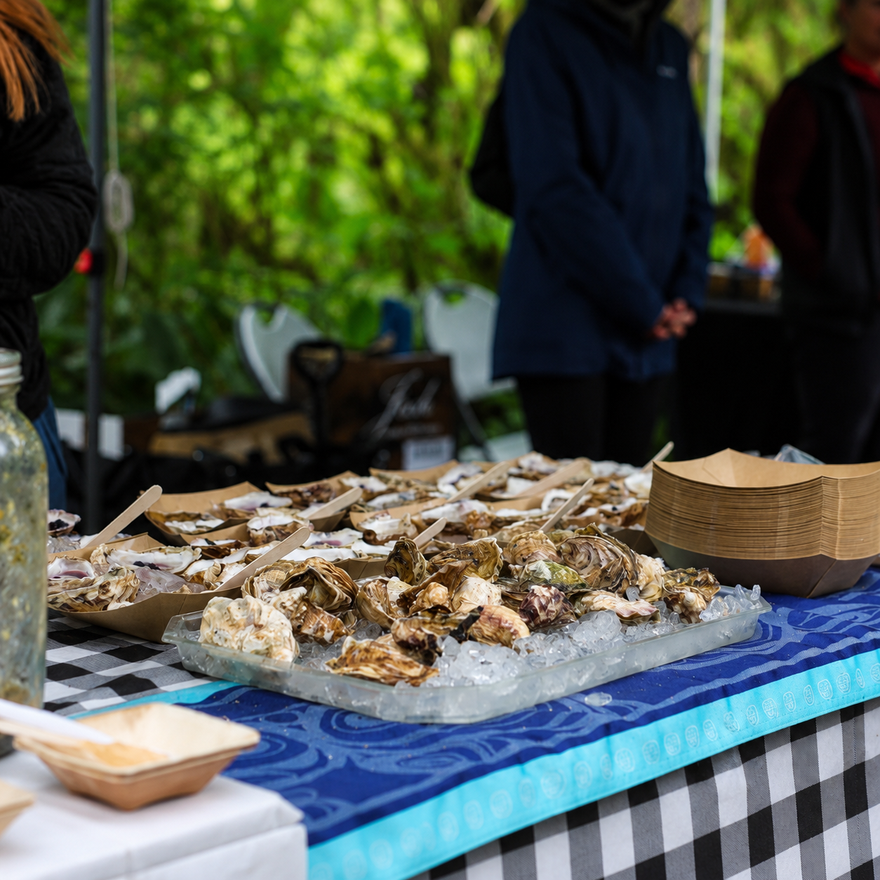 Oyster tasting plate with local accompaniments at Coastal Flavors of Klawock