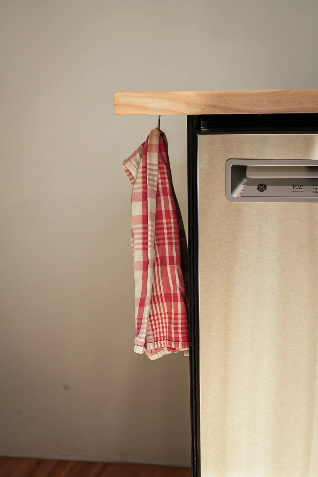 Dish towel hanging from a hook on the mobile kitchen