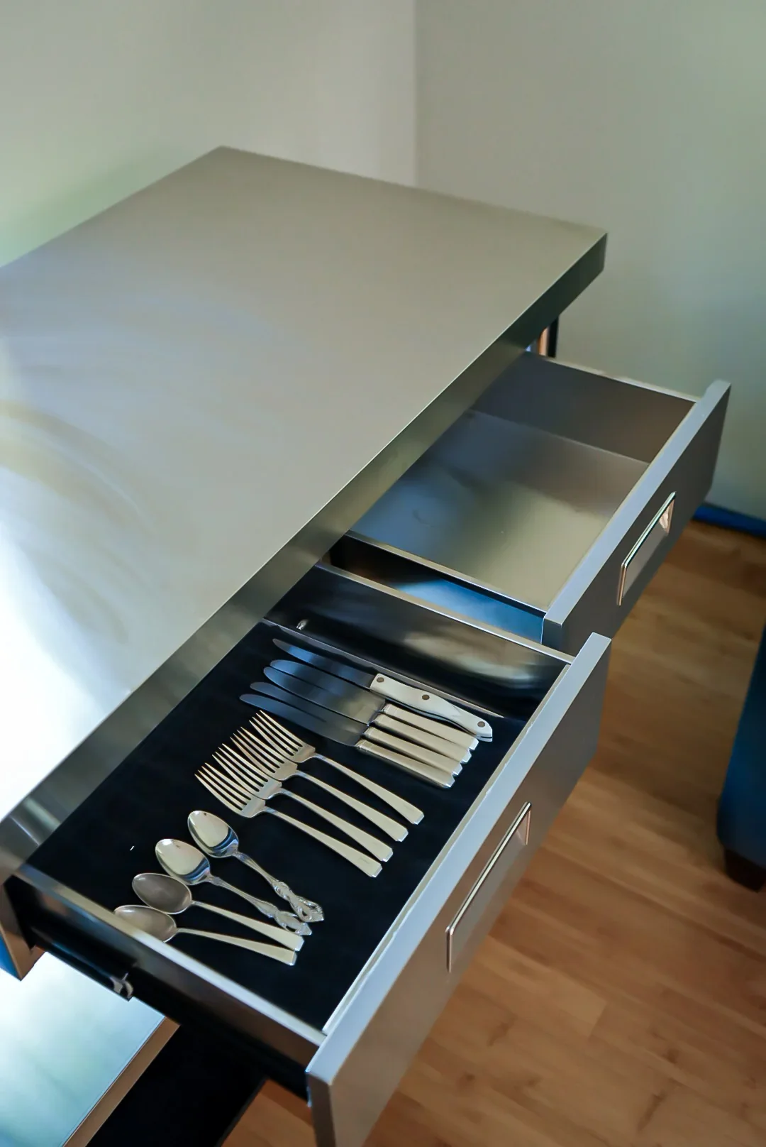 Open drawer holding silverware in the mobile kitchen
