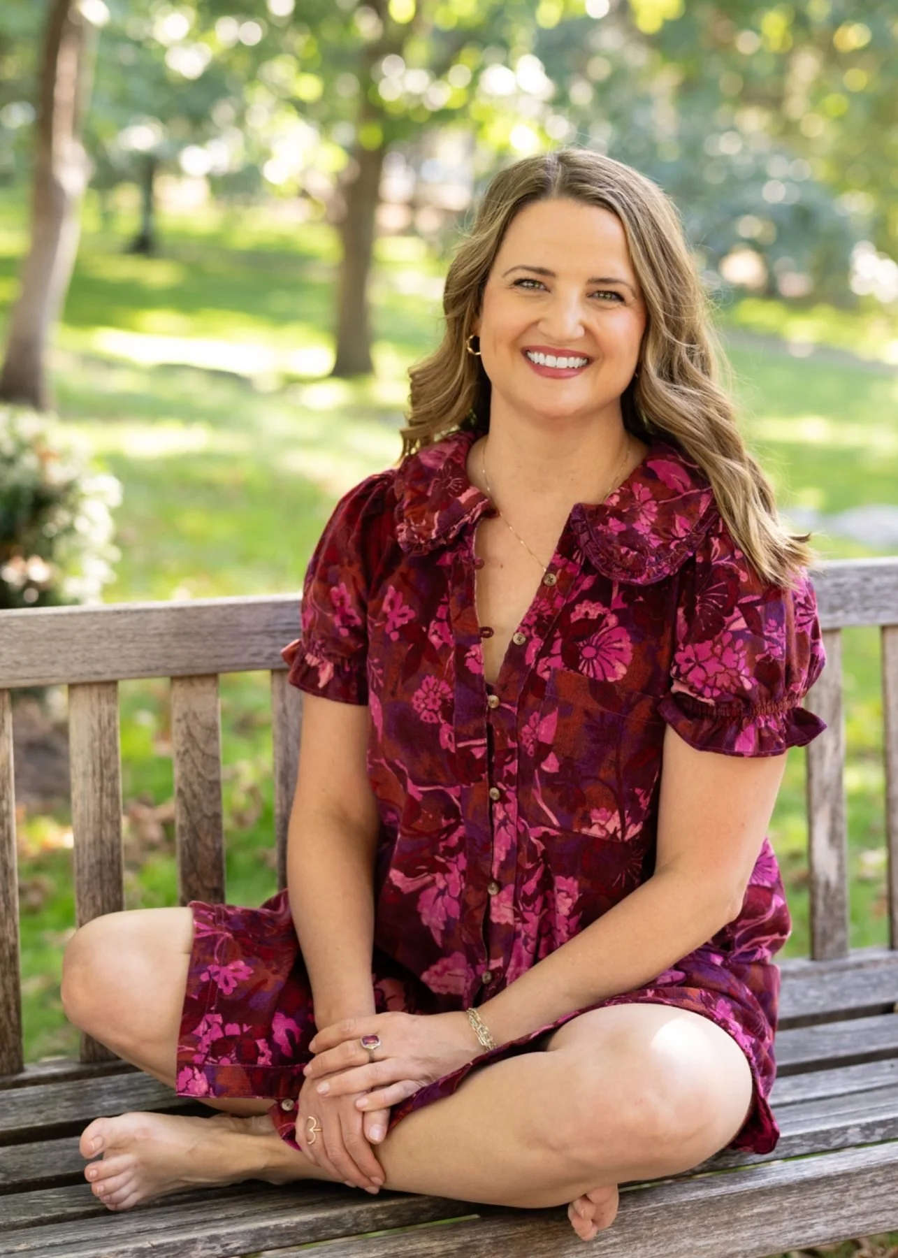 Emily Kathryn sitting peacefully on a park bench
