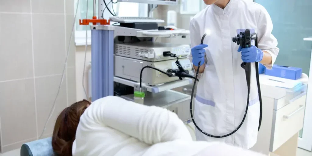 Technician preparing endoscopy equipment