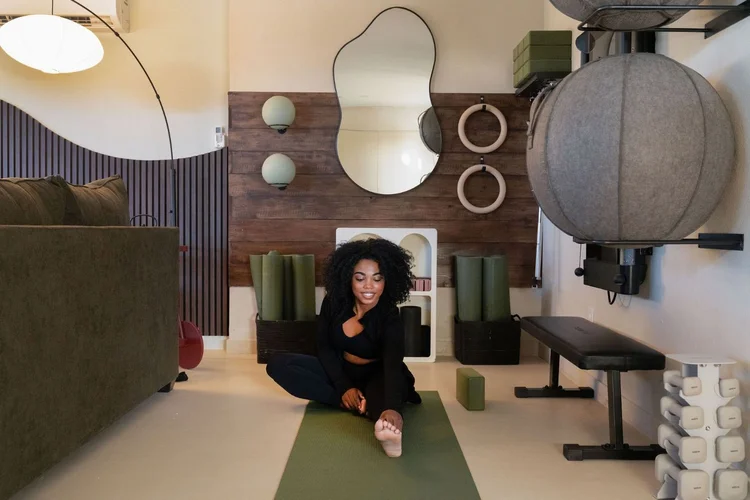 Tonal home gym and yoga mat in the flex lounge