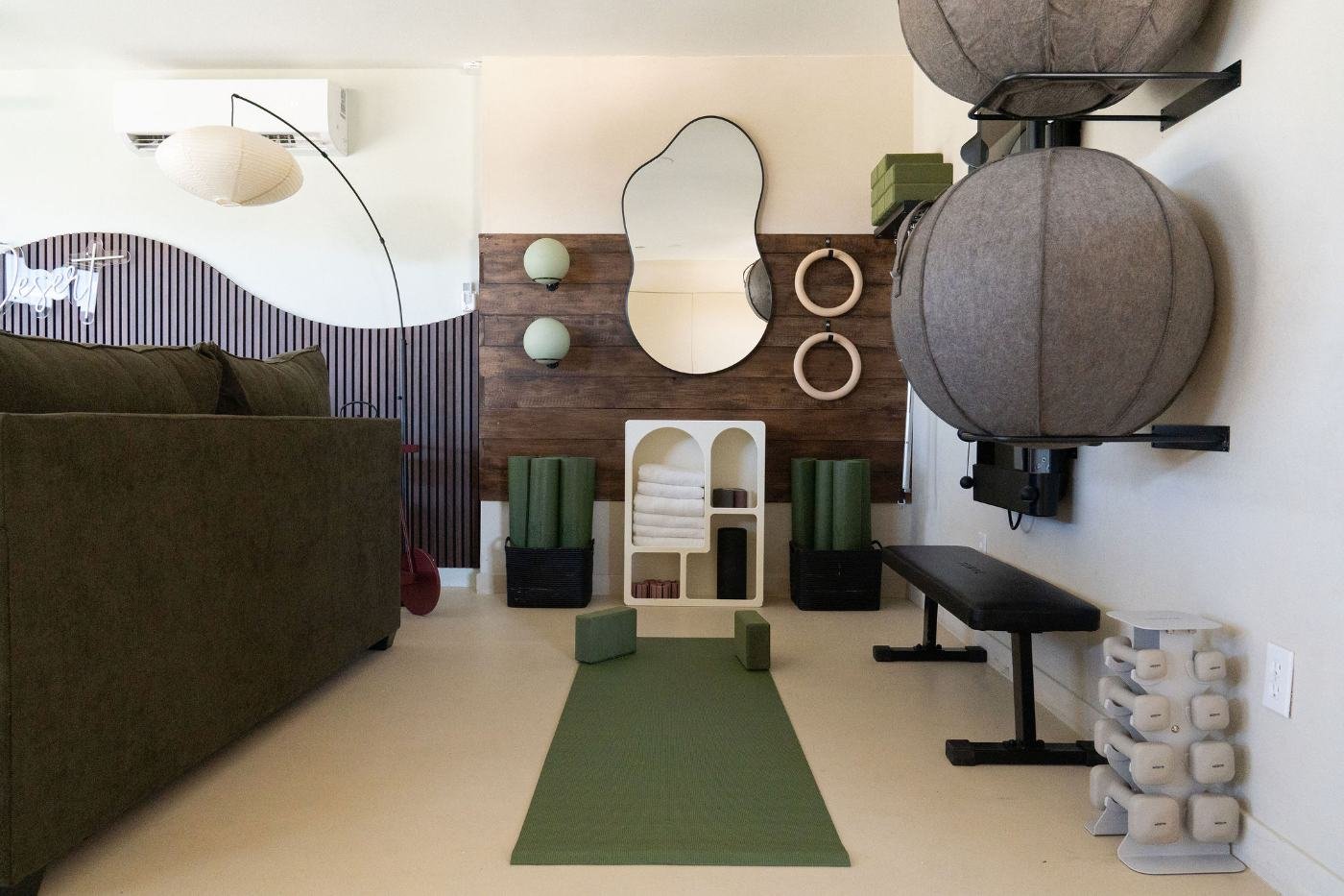Flex lounge home gym with Tonal, rings and yoga mats at The Desert Willow Joshua Tree