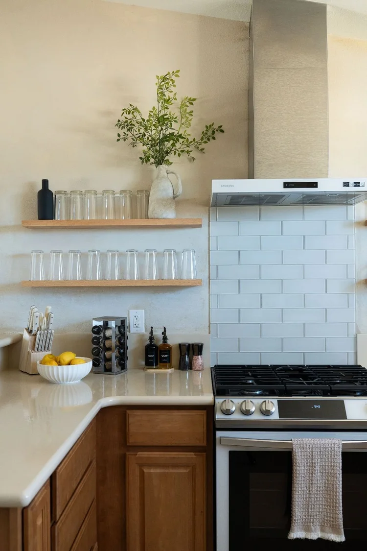 Kitchen with wood cabinets and lemons on the counter