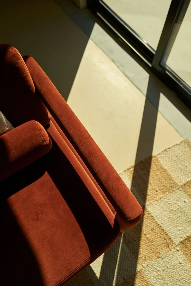 Rust armchair and art prints