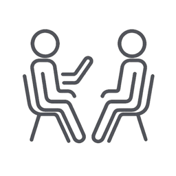 Icon of two people sitting together, representing comfort, safety, and emotional ease