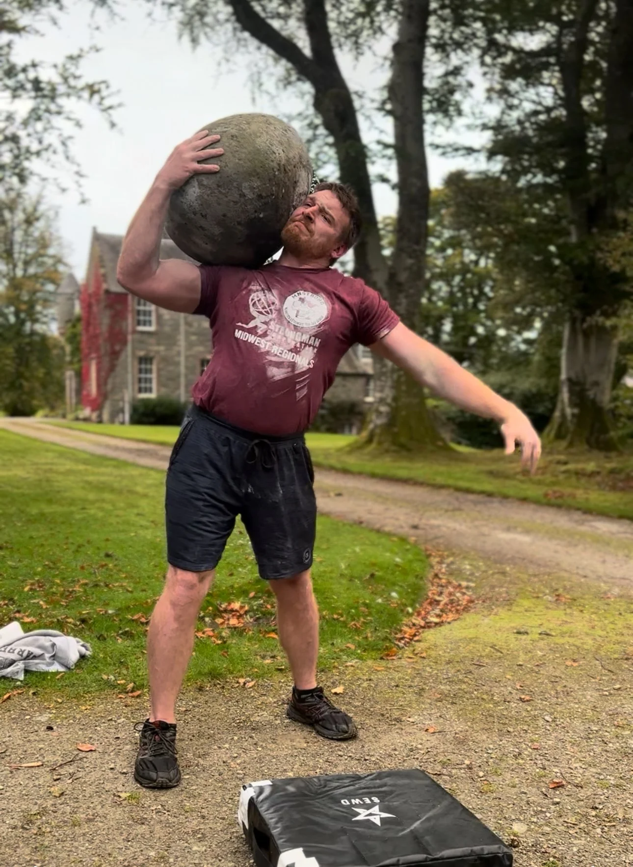 Tim shouldering the Ardvorlich Stone, Scotland 2025