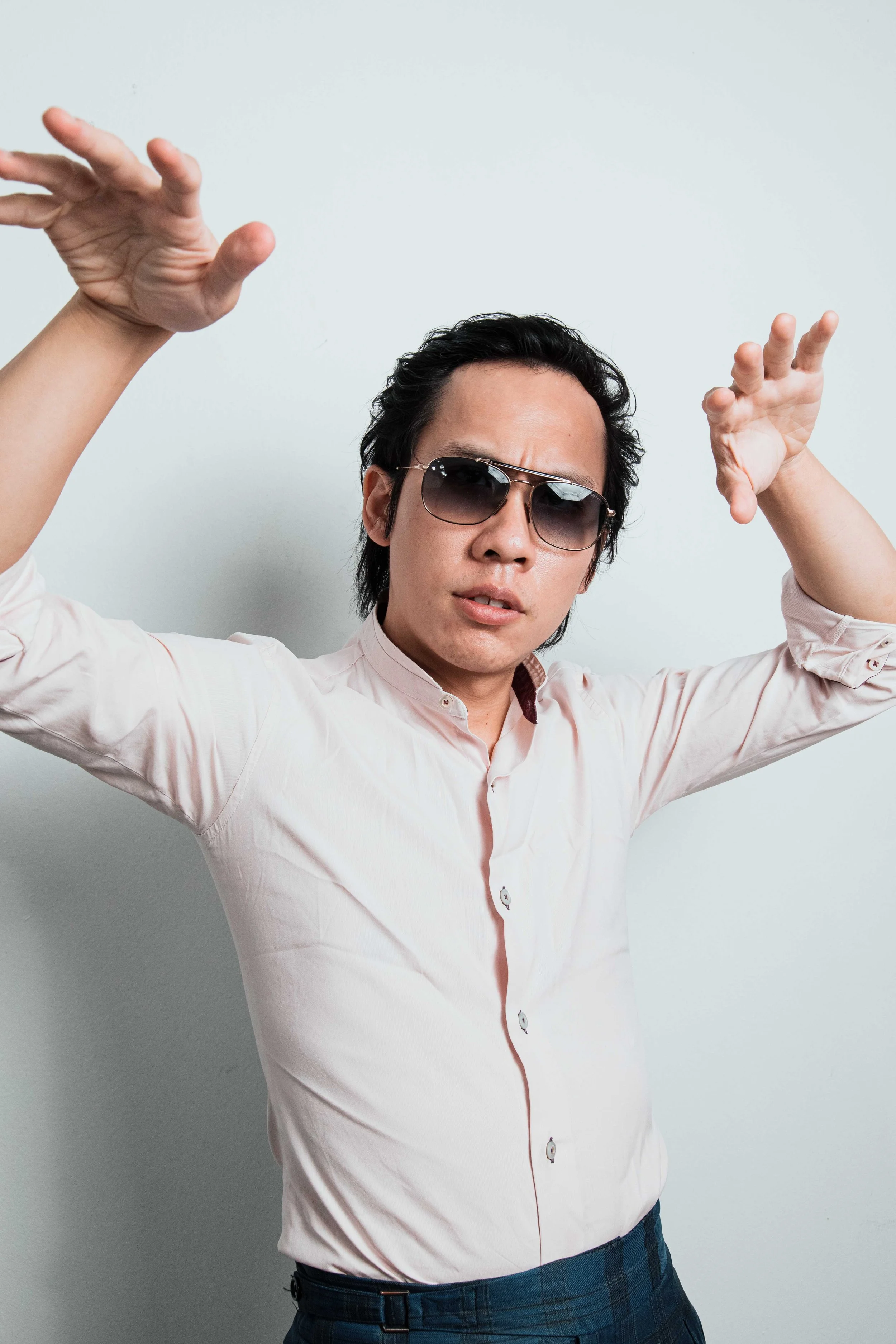 Ah Vi Vi posing in a studio during a social media content shoot